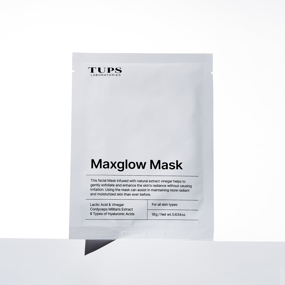 TUPS Maxglow Mask sachet standing against a white background. The mask is formulated with lactic acid, vinegar, Cordyceps Militaris extract, and eight types of hyaluronic acids to gently exfoliate, boost radiance, and hydrate all skin types