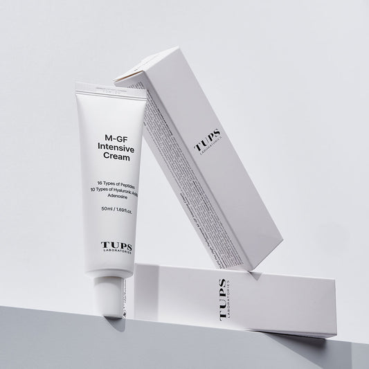 TUPS Laboratories M-GF Intensive Cream tube with packaging boxes displayed against a light background. The cream contains 16 types of peptides, 10 types of hyaluronic acids, and adenosine for intensive skin care