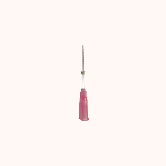Close-up image of a SILK Premium Threads Mono Volume PDO thread needle with a pink handle, featuring a twisted thread design and a transparent guide tube, displayed against a light beige background